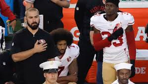 Athletes Taking Stand by Kneeling