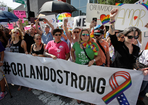 Counter demonstrators show support and solidarity near the funeral service for Christopher Andrew Leinonen, one of the victims of the Pulse nightclub mass shooting, outside the Cathedral Church of St. Luke, Saturday, June 18, 2016, in Orlando, Fla. (AP Photo/John Raoux)