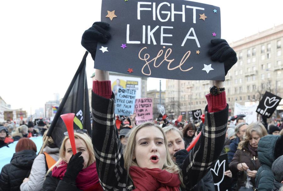 Protesters shout slogans during a nationwide rally on International Womens Day, in Warsaw, Poland, Wednesday, March 8, 2017. Women across Poland are staging rallies and marches to demand protection against violence, equal rights and respect. (AP Photo/Alik Keplicz)
