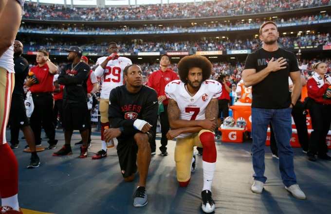 SAN DIEGO, CA - SEPTEMBER 1: Eric Reid #35 and Colin Kaepernick #7 of the San Francisco 49ers kneel on the sideline during the anthem, as free agent Nate Boyer stands, prior to the game against the San Diego Chargers at Qualcomm Stadium on September 1, 2016 in San Diego, California. The 49ers defeated the Chargers 31-21. (Photo by Michael Zagaris/San Francisco 49ers/Getty Images)  *** Local Caption *** Eric Reid;Colin Kaepernick;Nate Boyer