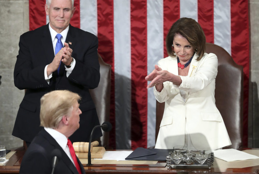 President Donald Trump turns to House speaker Nancy Pelosi of Calif., as he delivers his State of the Union address to a joint session of Congress on Capitol Hill in Washington, as Vice President Mike Pence watches, Tuesday, Feb. 5, 2019. (AP Photo/Andrew Harnik)