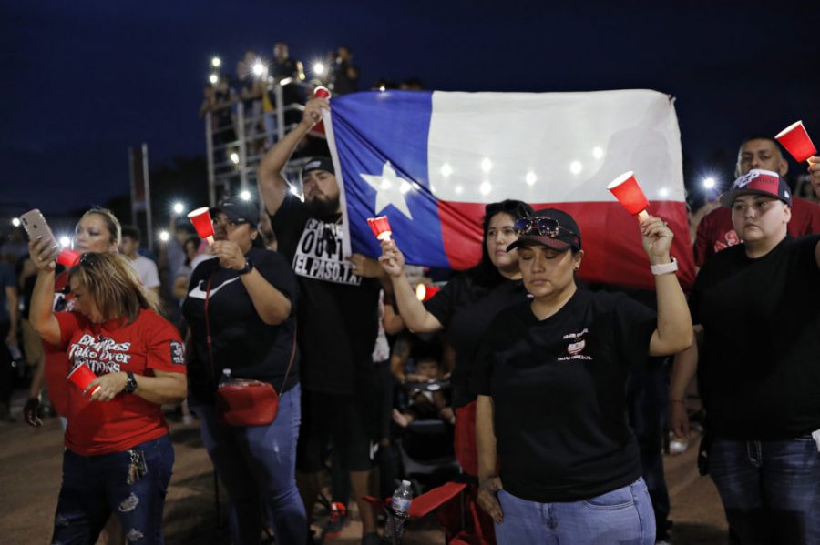 People attend a vigil for victims of Saturdays mass shooting at a shopping complex Sunday, Aug. 4, 2019, in El Paso, Texas. (AP Photo/John Locher)