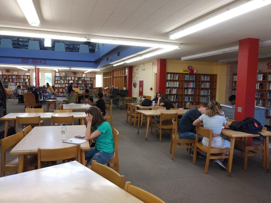 Students working in the library during tutoring.