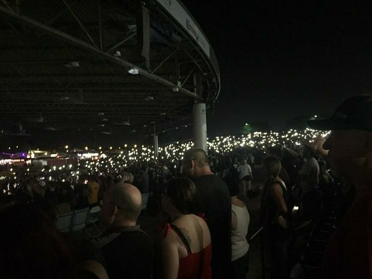 From the front to the back, fans turned on their phone flashlights and lighters.