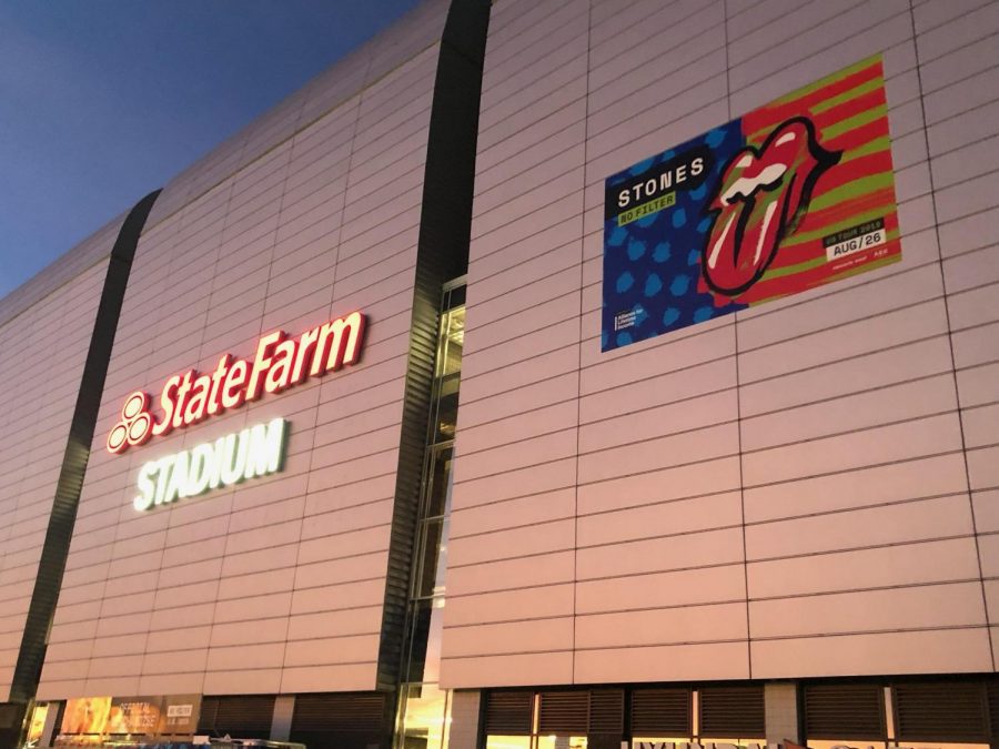 The outside of the State Farm Stadium with the poster for the show
