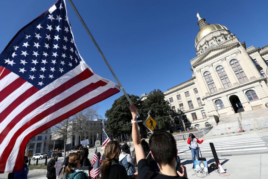 People gather outside the Georgia Capitol last month to demonstrate against proposed voting legislation. (Dustin Chambers/Reuters)
