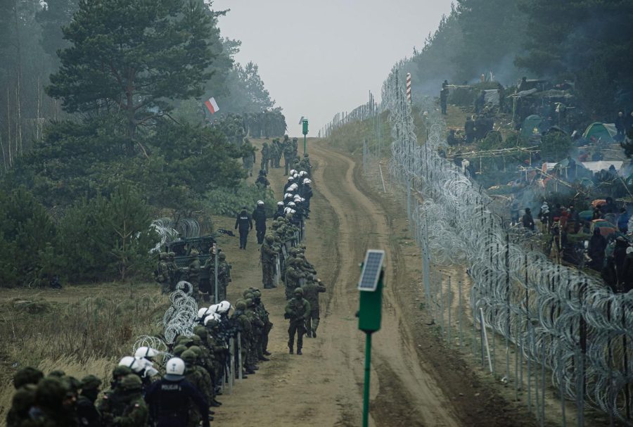 The border heavily guarded on the Polish side, and full of refugee camps on the other. 