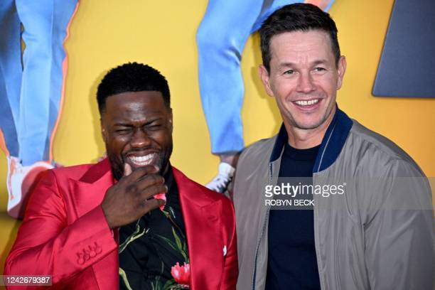 US actor and comedian Kevin Hart (L) and US actor Mark Wahlberg arrive for the premiere of Me Time at the Regency Village Theatre in Westwood, Los Angeles, California, on August 23, 2022. (Photo by Robyn Beck / AFP) (Photo by ROBYN BECK/AFP via Getty Images)