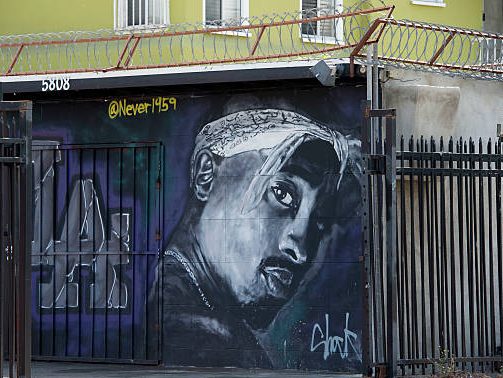 A wall dedicated to the memory of US rapper Tupac Shakur is seen on May 26, 2016 in  Los Angeles, California. 
Twenty years after his death, Tupac still reigns. Other rappers have succeeded him in stardom, and promotional efforts around Tupac have been haphazard, but the artist who died at age 25 on September 13, 1996, in Las Vegas, maintains a hold that is among the most enduring in recent times.  / AFP / VALERIE MACON / TO GO WITH AFP STORY by Shaun TANDON, 20 years on, Tupac reigns as potent global force        (Photo credit should read VALERIE MACON/AFP via Getty Images)
